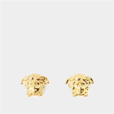 Boucle d’oreille unique Medusa en doré – Versace .